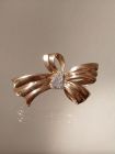 Goldene Maschenbrosche mit Diamanten